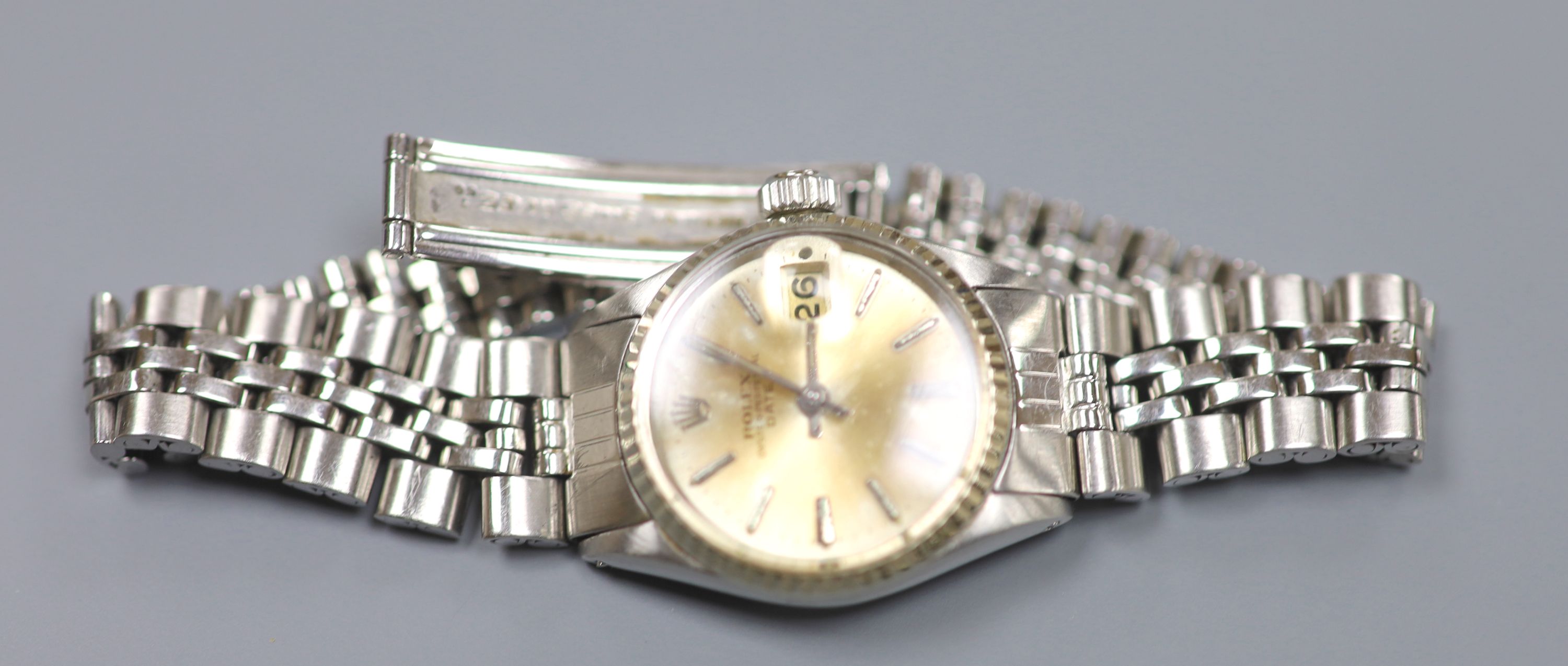 A ladys 1960s stainless steel Rolex Oyster Perpetual Date wrist watch, on Rolex bracelet, model no. 6517, serial no.1529297,